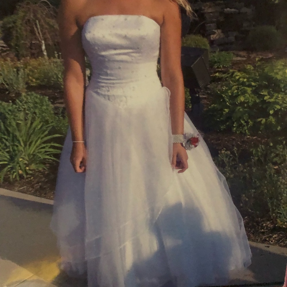 Gorgeous floor length strapless wedding gown.